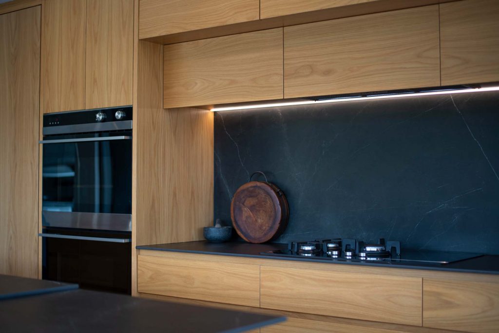 Kitchens-By-John-Prosser-Auckland-Blatch-Wooden-Kitchen-Cabinetry-Black-Granite-Back-Lit