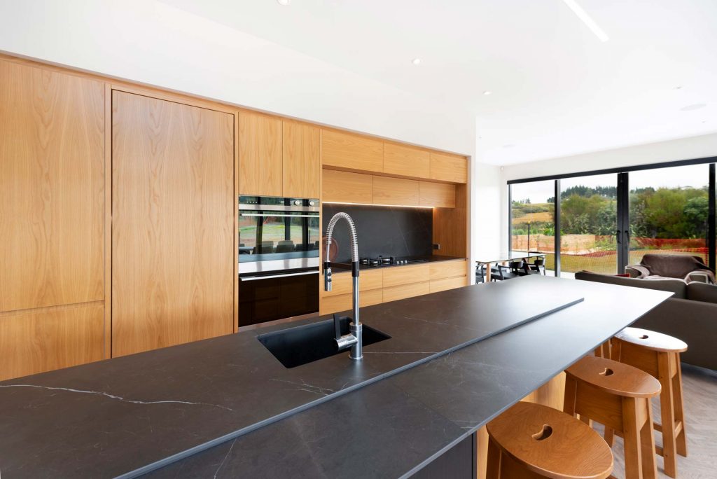 Kitchens-By-John-Prosser-Auckland-Blatch-Wooden-Kitchen-Cabinetry-Black-Granite-Cooking